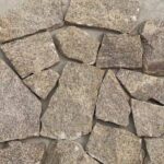 A collection of irregular flagstone pavers in various colors and textures