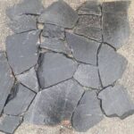 Collection of irregular flagstone pavers in various shapes and colors