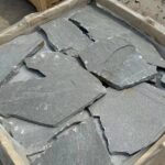 A variety of irregular flagstone pavers in natural colors
