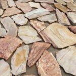 Collection of irregular flagstone pavers in various textures and colors