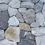 A collection of irregular flagstone pavers in various shapes and colors
