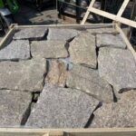 Collection of irregular flagstone pavers in various shades.