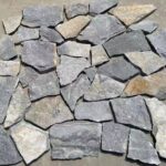 Collection of irregular flagstone pavers in natural tones for landscaping