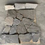 Variety of irregular flagstone pavers in natural tones for landscaping