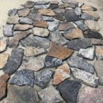 Variety of irregular flagstone pavers in different shapes and sizes.